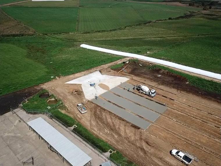 Drone view of dairy feed pad strips being poured on a Midlands farm